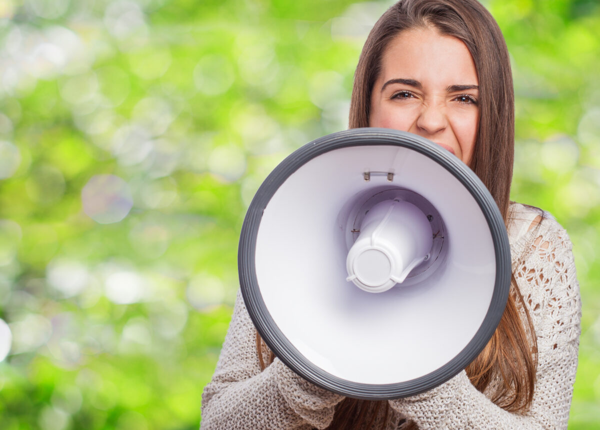 freepik: girl talking on the megaphone